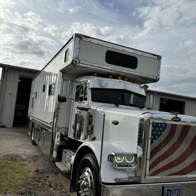 White custom Peterbilt RV toterhome with American flag grille detailing after a full detail in Southwest Florida