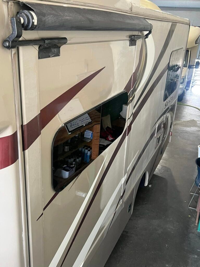 Thor Siesta motorhome with polished side panels during RV detailing in a Southwest Florida shop
