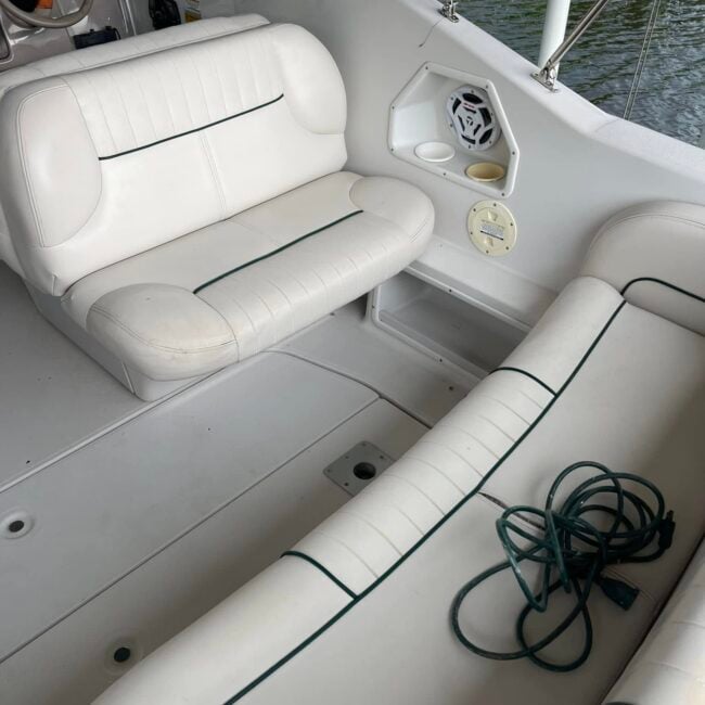 Clean bright white boat seat cushions after mildew removal and vinyl detailing in Southwest Florida