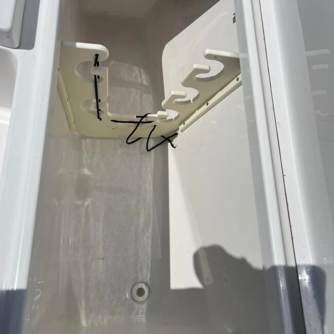 Clean white boat storage locker after deep cleaning and marine detailing in Southwest Florida