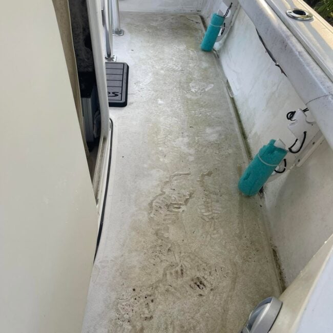 Dirty stained boat cockpit deck before deck cleaning and marine detailing in Southwest Florida