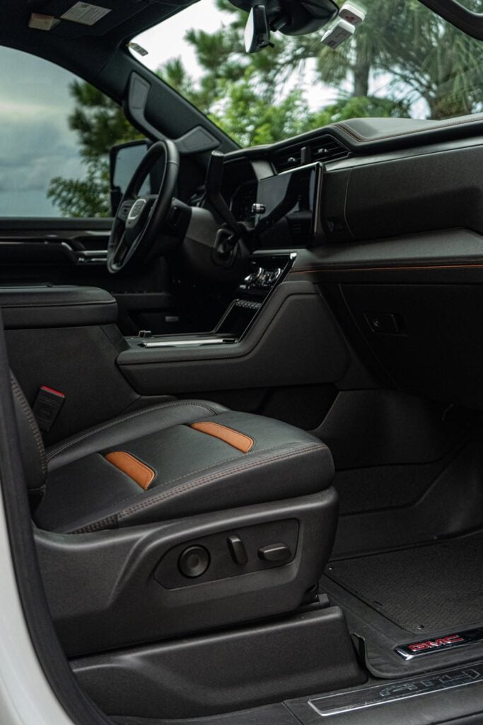 Clean GMC AT4 truck interior with black and tan leather seats after interior detailing in Southwest Florida